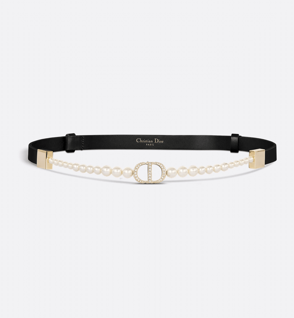 Dior 30 Montaigne Pearls Belt in black calfskin with a Swarovski® crystal-embellished CD buckle and white resin pearl detailing for a timeless, luxurious style.