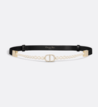 Dior 30 Montaigne Pearls Belt in black calfskin with a Swarovski® crystal-embellished CD buckle and white resin pearl detailing for a timeless, luxurious style.