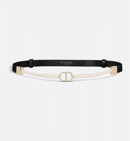 Dior 30 Montaigne Pearls Belt in black calfskin with a Swarovski® crystal-embellished CD buckle and white resin pearl detailing for a timeless, luxurious style.