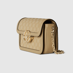 Gucci Go Small Shoulder Bag in Beige GG canvas with gold-toned hardware, a detachable mirror, and an adjustable strap for versatile styling.