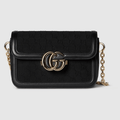 Gucci Go Small Shoulder Bag in Black GG canvas with gold-toned hardware, a detachable mirror, and an adjustable strap for versatile styling.