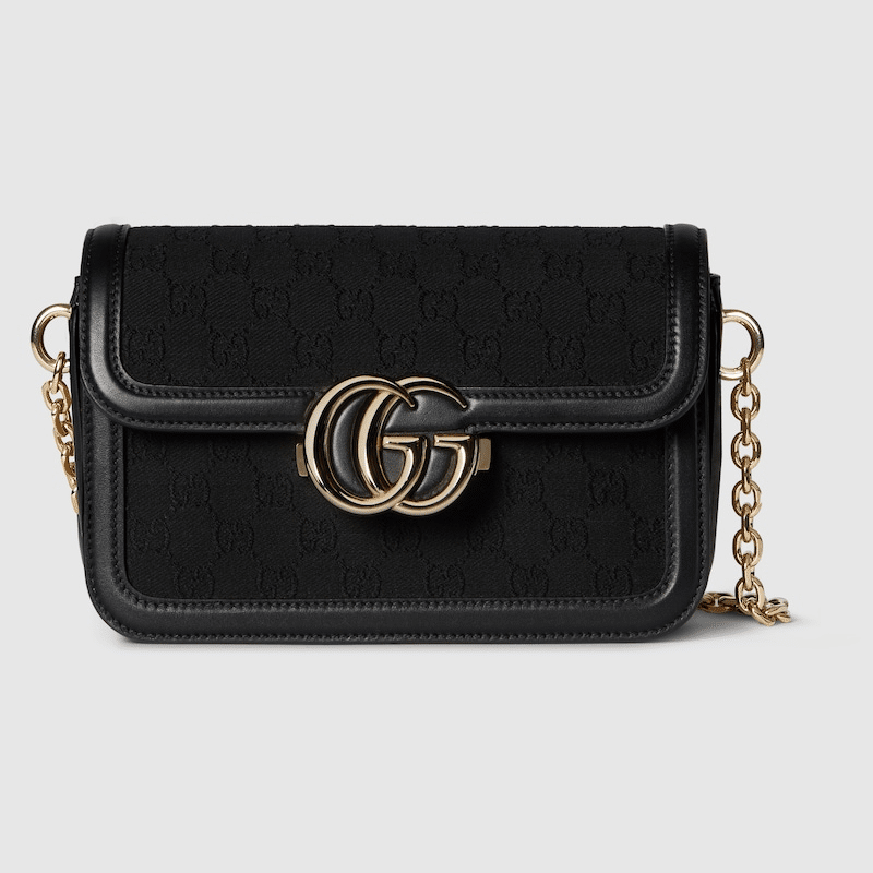 Gucci Go Small Shoulder Bag in Black GG canvas with gold-toned hardware, a detachable mirror, and an adjustable strap for versatile styling.