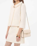 Small Rockstud Grainy Calfskin Crossbody Bag