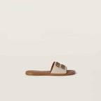 MiuMiu Canvas and leather slides