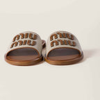 MiuMiu Canvas and leather slides
