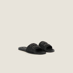 MiuMiu Raffia-effect woven fabric slides