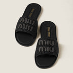 MiuMiu Raffia-effect woven fabric slides