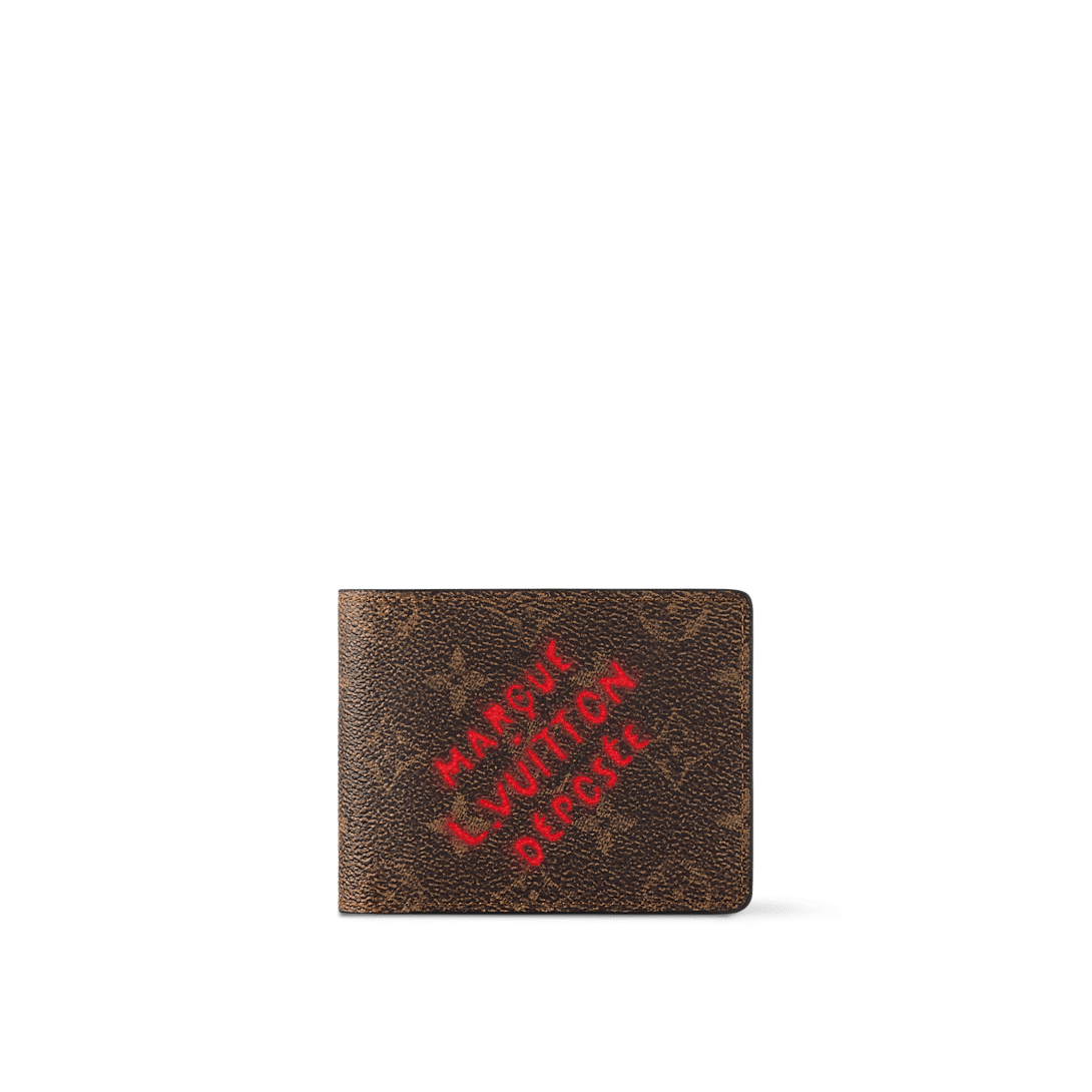 Louis Vuitton Multiple Wallet in Monogram Dust canvas with red "Marque L.Vuitton Déposée" print, aged leather trim, and multiple compartments.