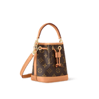 Mini Nano Noé bag in Monogram canvas with cowhide leather trim, drawstring closure, and removable strap for versatile wear.
