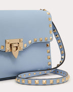 SMALL ROCKSTUD GRAINY CALFSKIN CROSSBODY BAG