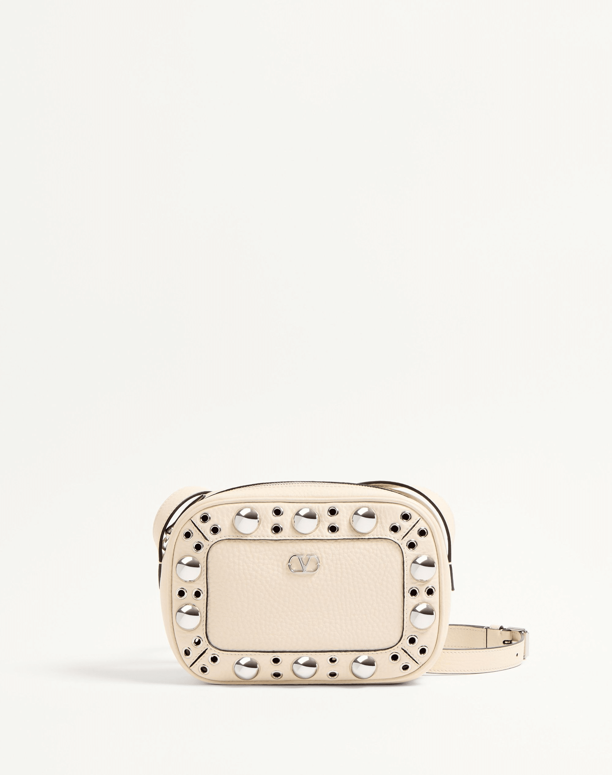 A Valentino Garavani Nellcôte chain shoulder bag in grainy calfskin leather, adorned with ball studs and rivets. Features a VLogo Signature metallic accent, palladium-finish hardware, zipper closure, and an adjustable leather strap for shoulder or cross-body wear. The suede-lined interior includes a card pocket for storage.