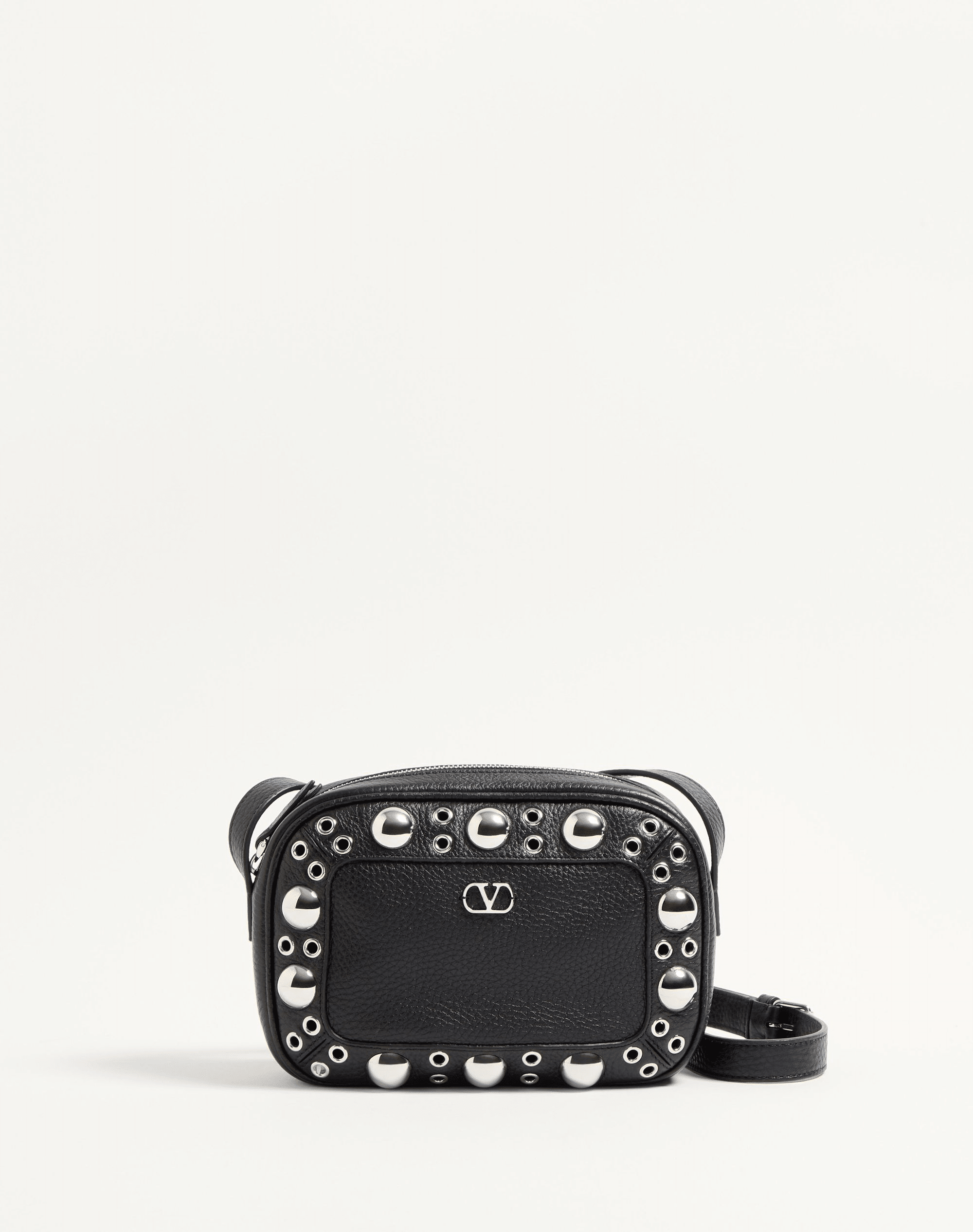 Valentino Garavani Nellcôte shoulder bag in grainy calfskin leather, featuring ball stud and rivet detailing, a VLogo Signature, palladium-finish hardware, and an adjustable leather strap for cross-body wear.