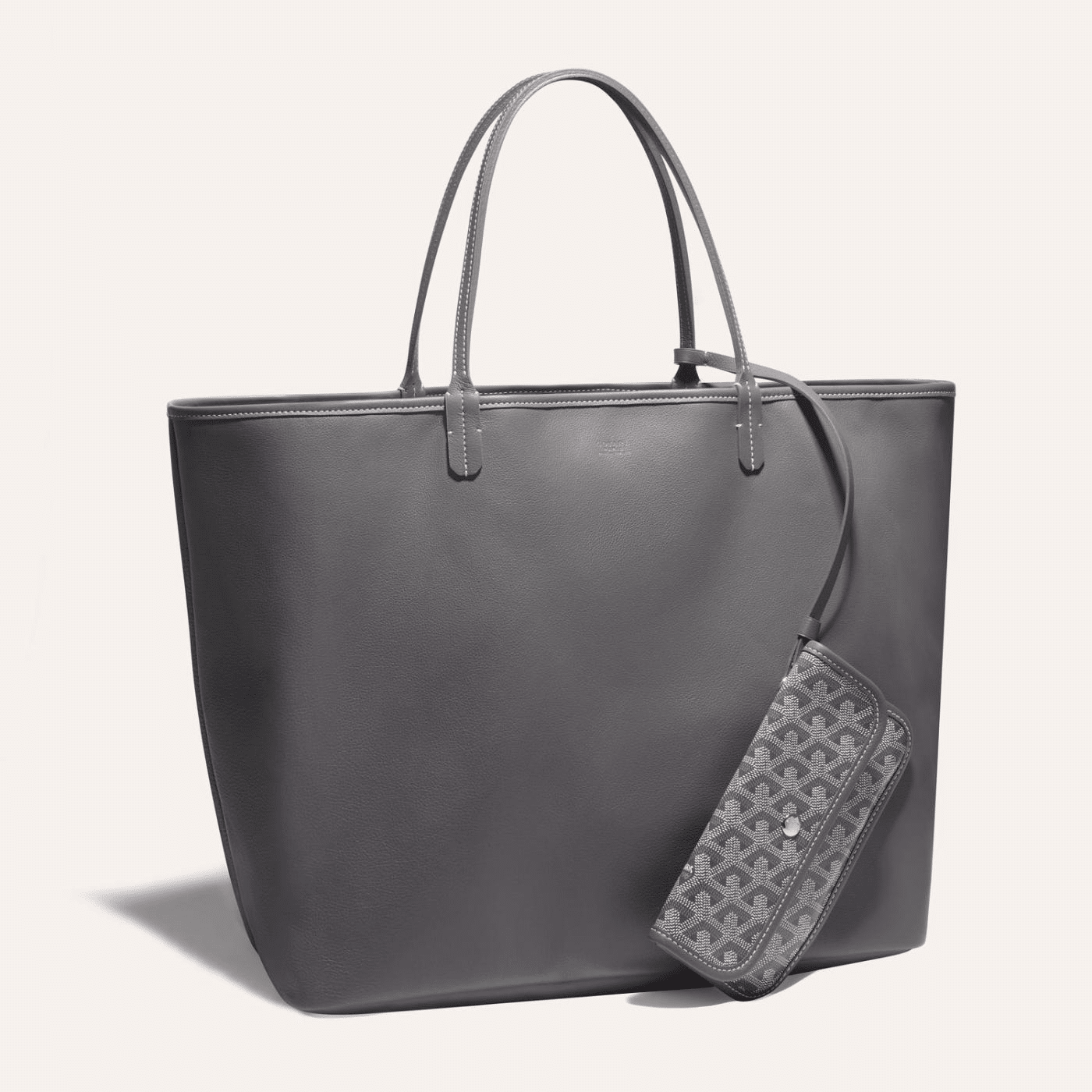 Goyard Anjou GM bag featuring a reversible leather and Goyardine canvas design, ergonomic handles, and a spacious interior for daily essentials.