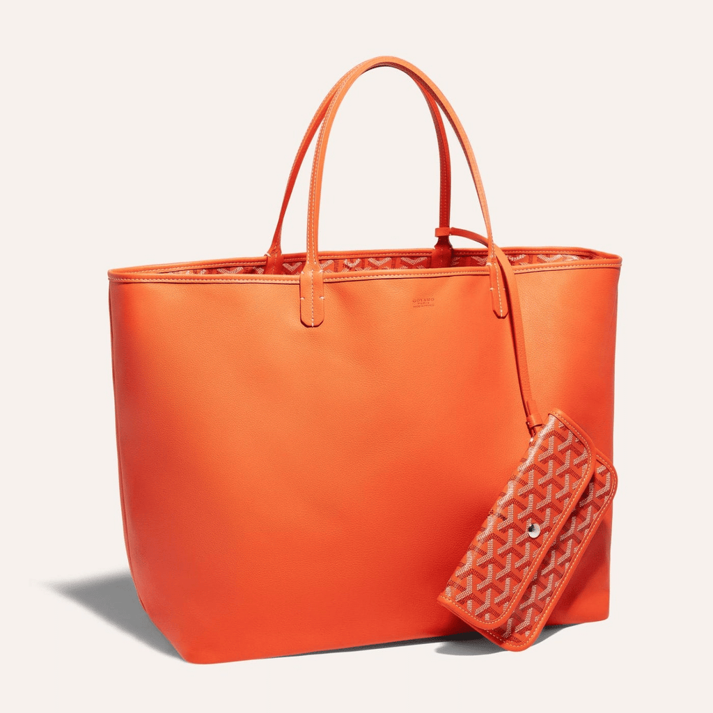 Goyard Anjou GM bag featuring a reversible leather and Goyardine canvas design, spacious interior, and ergonomic handles for comfortable carrying