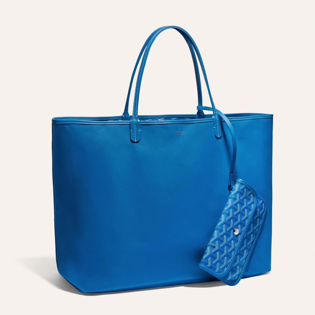 Goyard Anjou GM bag featuring a reversible leather and Goyardine canvas design, spacious interior, and ergonomic handles for enhanced comfort.