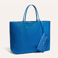 Goyard Anjou GM bag featuring a reversible leather and Goyardine canvas design, spacious interior, and ergonomic handles for enhanced comfort.