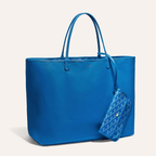 Goyard Anjou GM bag featuring a reversible leather and Goyardine canvas design, spacious interior, and ergonomic handles for enhanced comfort.