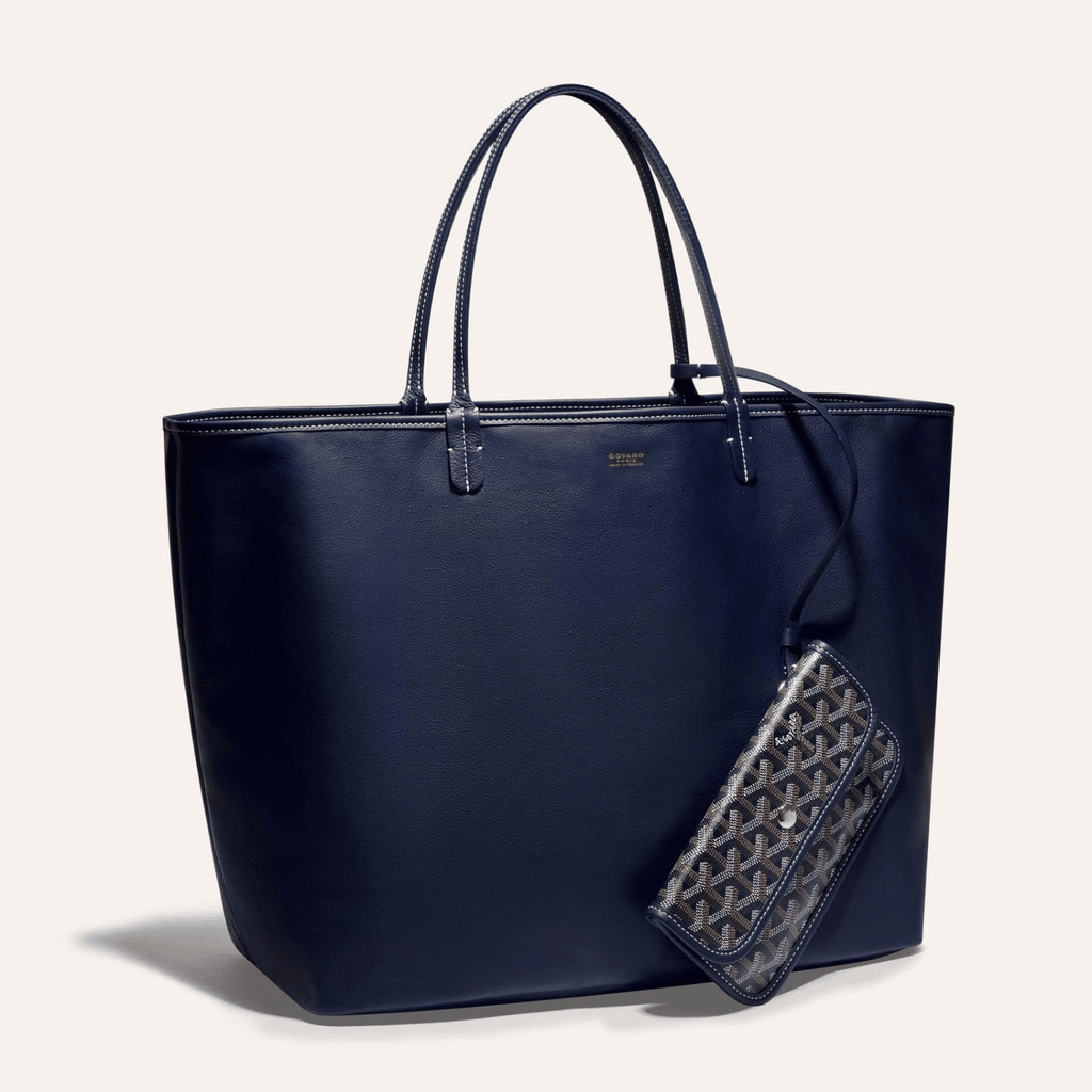 Goyard Anjou GM bag featuring a reversible leather and Goyardine canvas design, spacious interior, and ergonomic handles for all-day comfort.