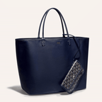Goyard Anjou GM bag featuring a reversible leather and Goyardine canvas design, spacious interior, and ergonomic handles for all-day comfort.