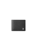 The Louis Vuitton Multiple Wallet in black Taiga leather features a sleek design with silver-tone LV Initials, multiple card slots, bill compartments, and a compact structure for everyday sophistication.
